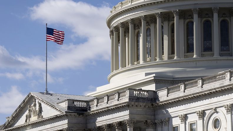 An American flag flies at the U.S. Capitol in Washington on March 6, 2021